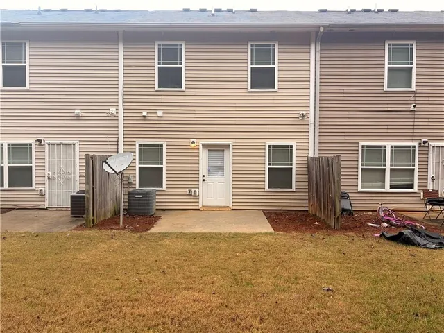 a view of a backyard of the house
