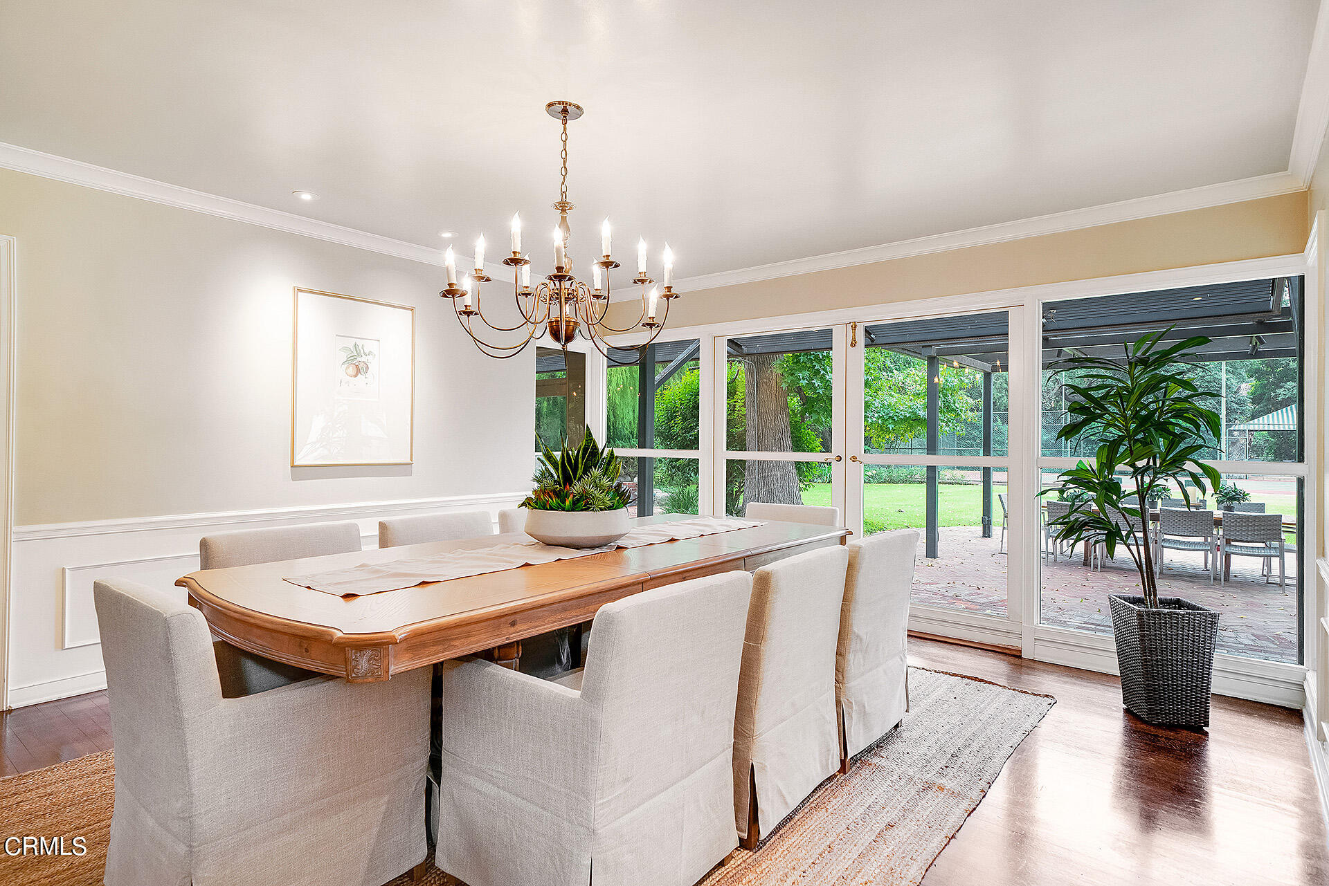 2035 South Oak Knoll Avenue San Marino, CA 91108 - Photo 16 of 28 a dining room with chandelier and wooden floor
