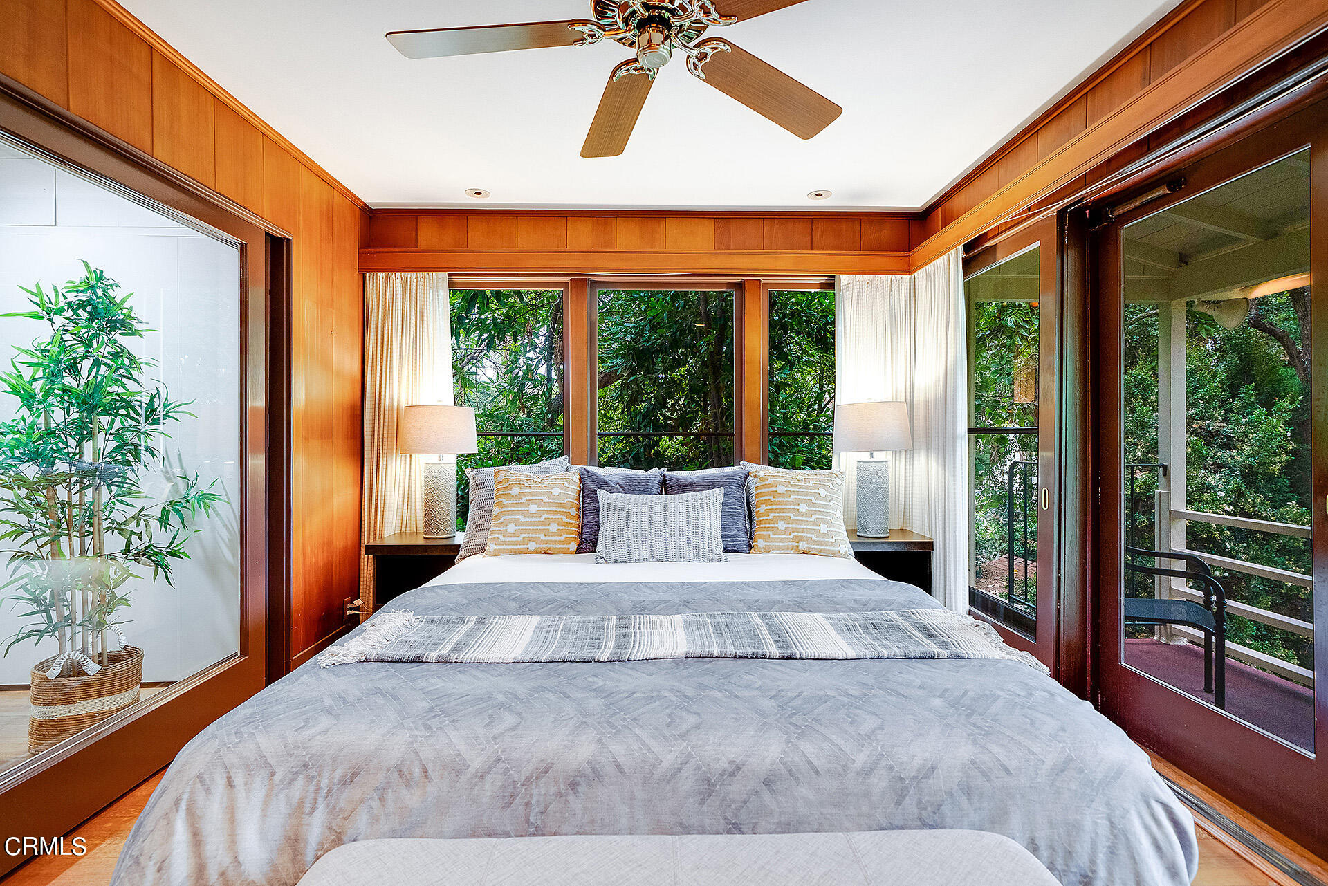 2035 South Oak Knoll Avenue San Marino, CA 91108 - Photo 19 of 28 a large bedroom with a large bed and a potted plant