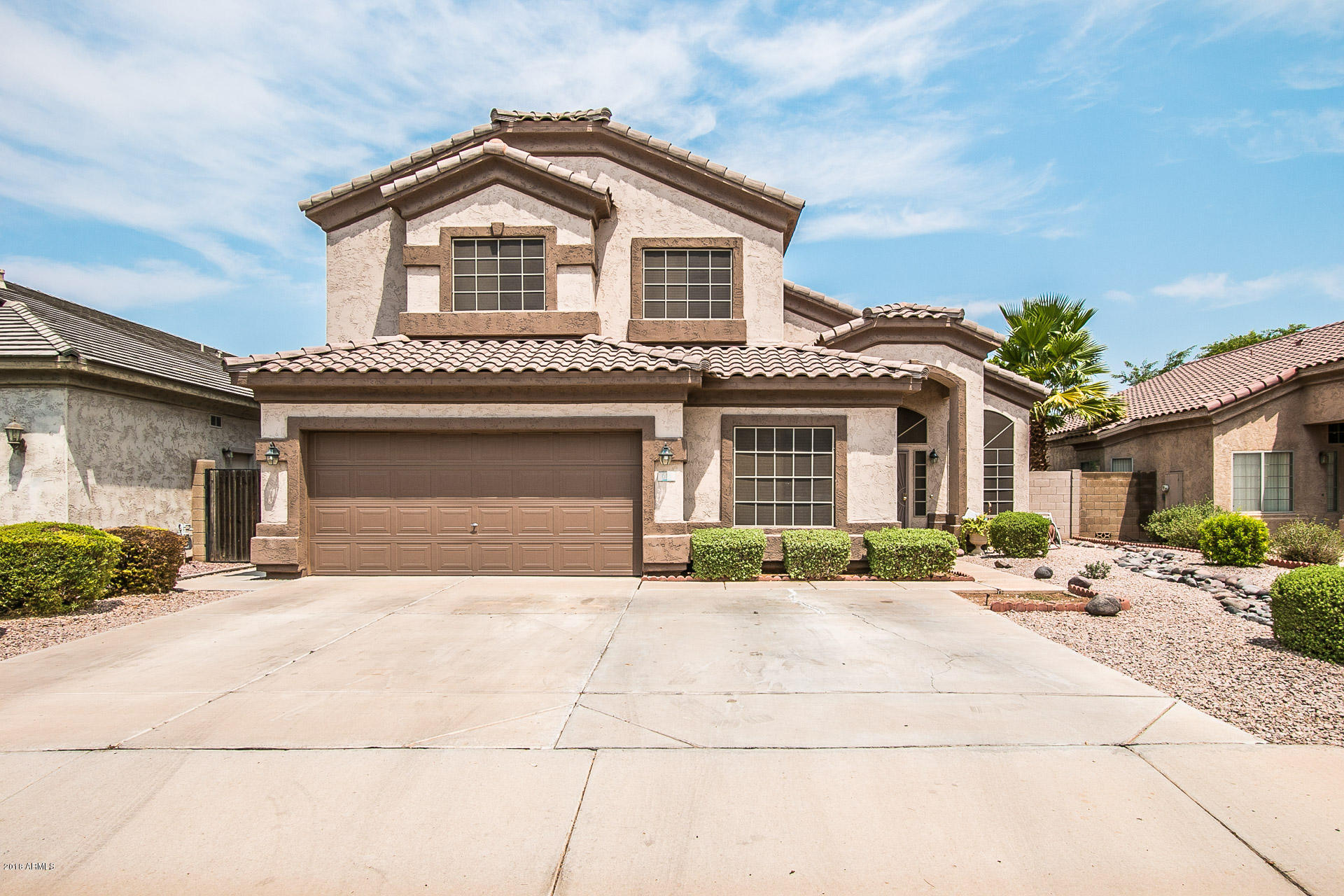 618 East Ranch Road Gilbert, AZ 85296 - Photo 1 of 32 a front view of a house with a patio