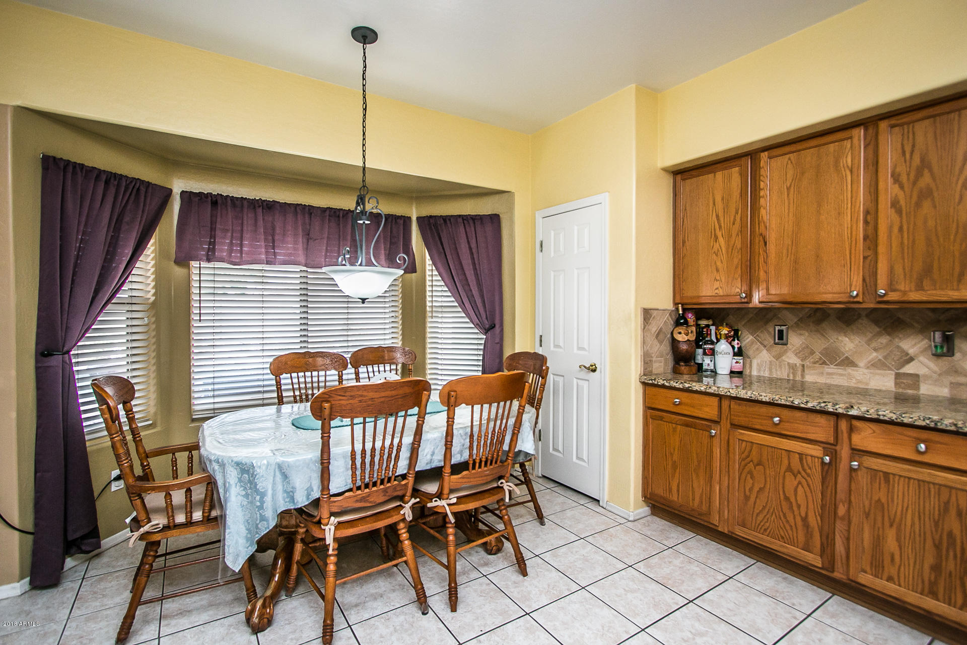 618 East Ranch Road Gilbert, AZ 85296 - Photo 15 of 32 a view of a dining room with furniture and window