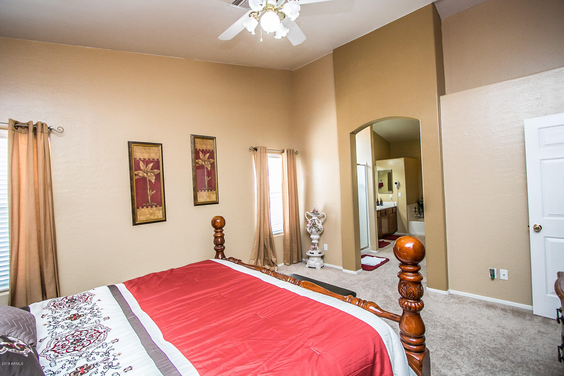 618 East Ranch Road Gilbert, AZ 85296 - Photo 20 of 32 a bedroom with a bed and a chandelier
