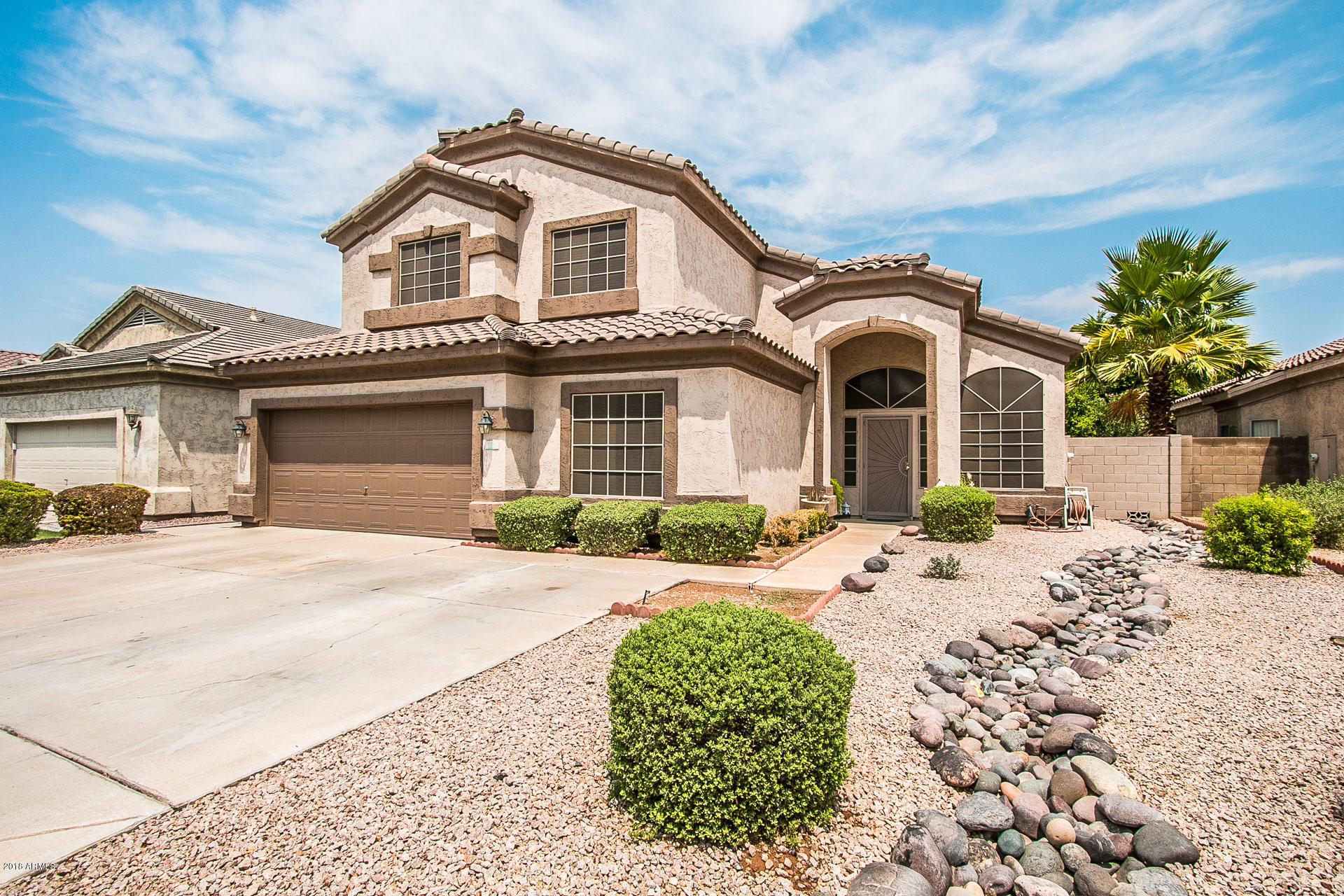 618 East Ranch Road Gilbert, AZ 85296 - Photo 2 of 32 a front view of a house with a patio
