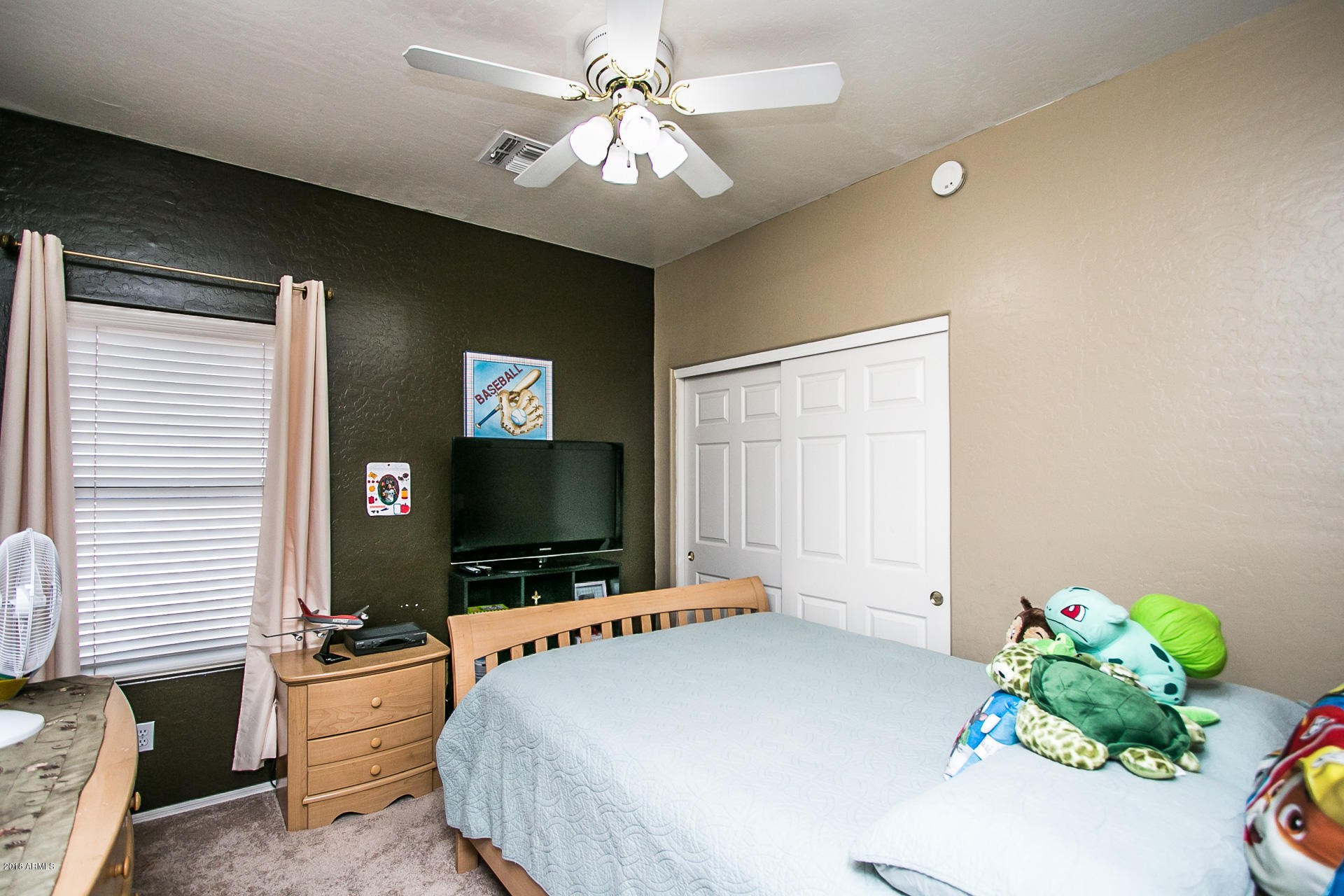 618 East Ranch Road Gilbert, AZ 85296 - Photo 23 of 32 a bedroom with a bed and a flat screen tv