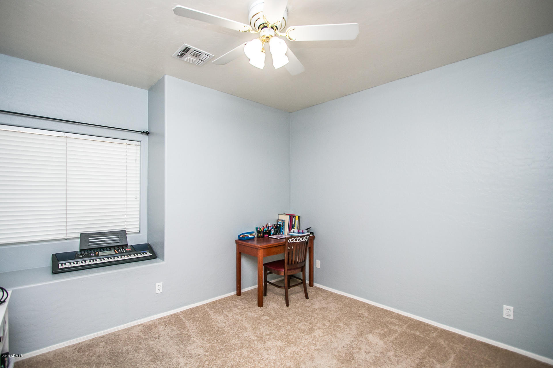 618 East Ranch Road Gilbert, AZ 85296 - Photo 25 of 32 a room with furniture and chandelier