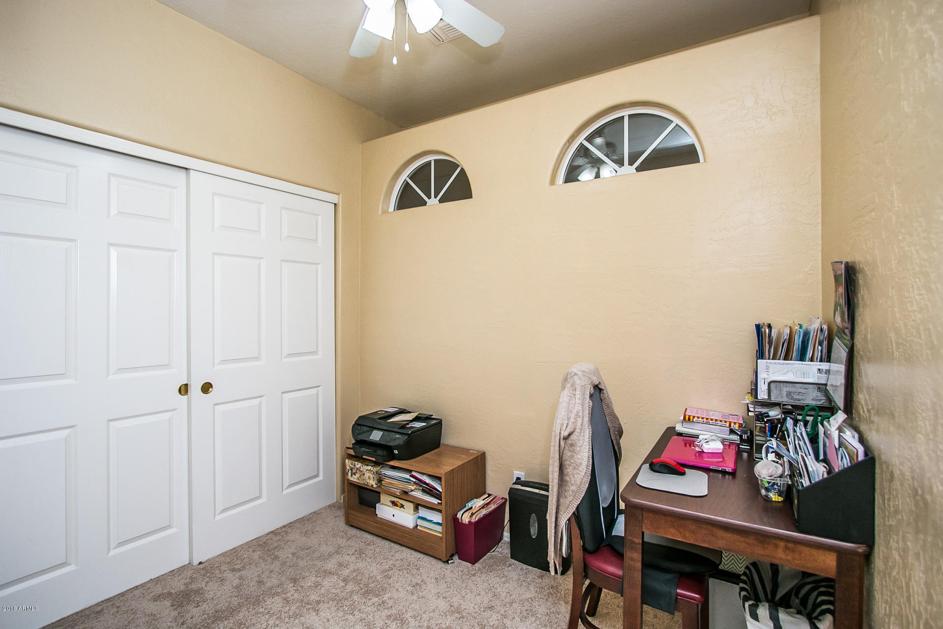618 East Ranch Road Gilbert, AZ 85296 - Photo 27 of 32 a living room with furniture and a flat screen tv