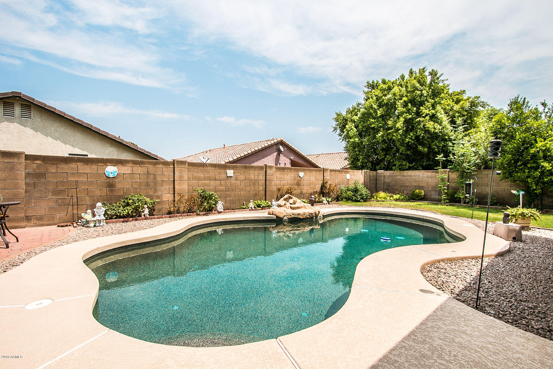 618 East Ranch Road Gilbert, AZ 85296 - Photo 28 of 32 a view of a swimming pool with lounge chair