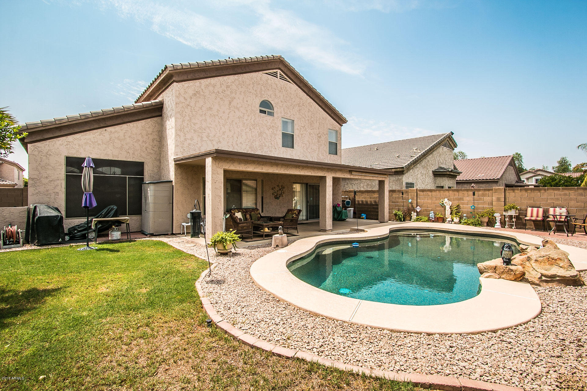 618 East Ranch Road Gilbert, AZ 85296 - Photo 30 of 32 a view of a house with swimming pool