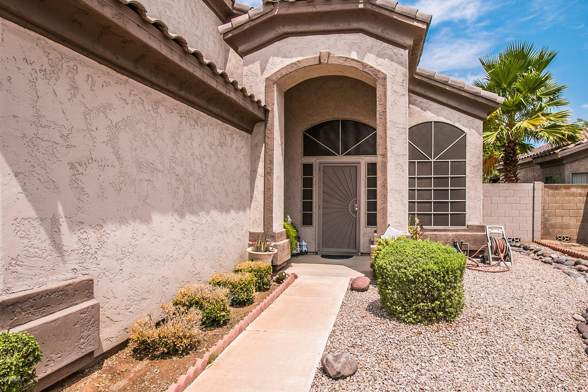 618 East Ranch Road Gilbert, AZ 85296 - Photo 3 of 32 a front view of a house with a outdoor space
