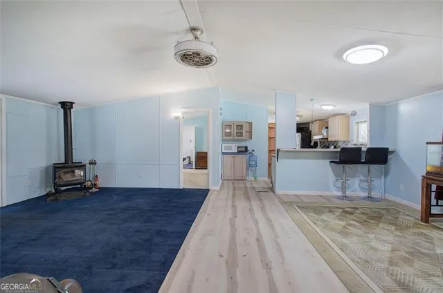 a view of kitchen with furniture and wooden floor
