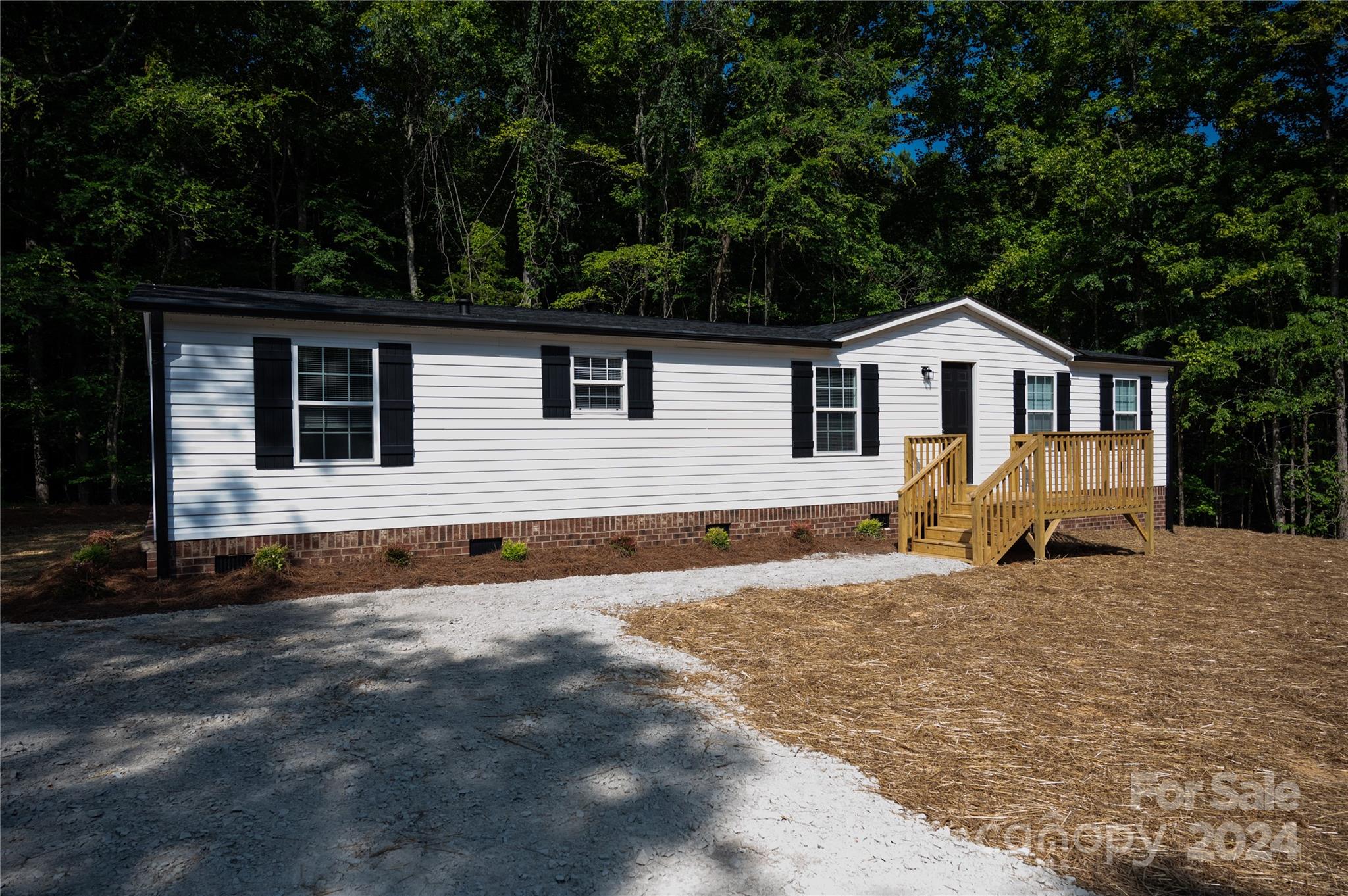 2574 Orchard Road Smyrna, SC 29743 - Photo 1 of 17 a view of a house with a patio