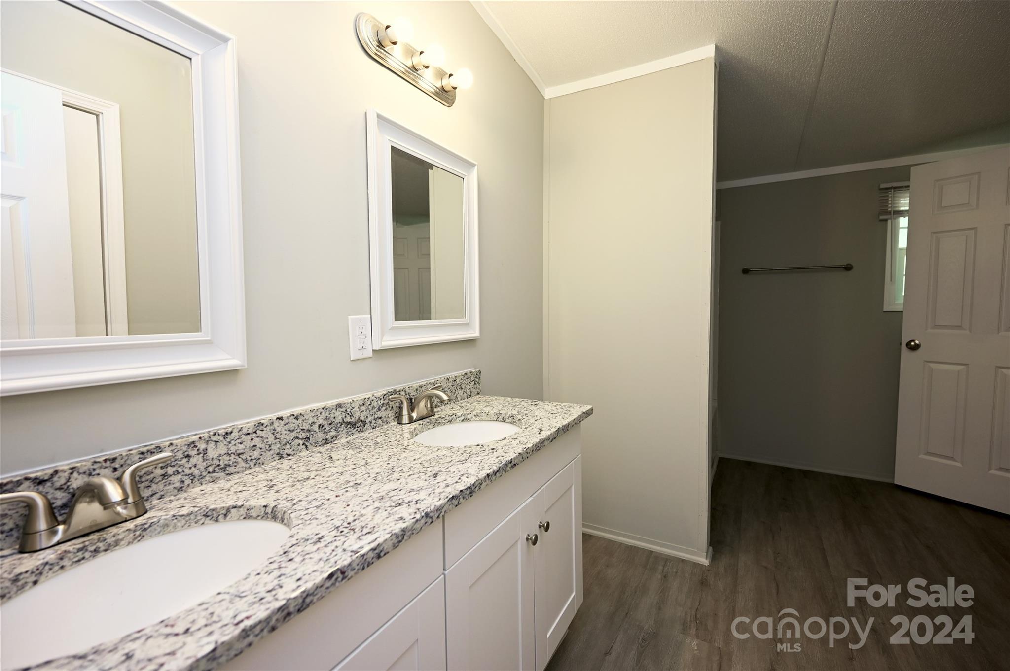 2574 Orchard Road Smyrna, SC 29743 - Photo 11 of 17 a bathroom with a granite countertop sink and a mirror