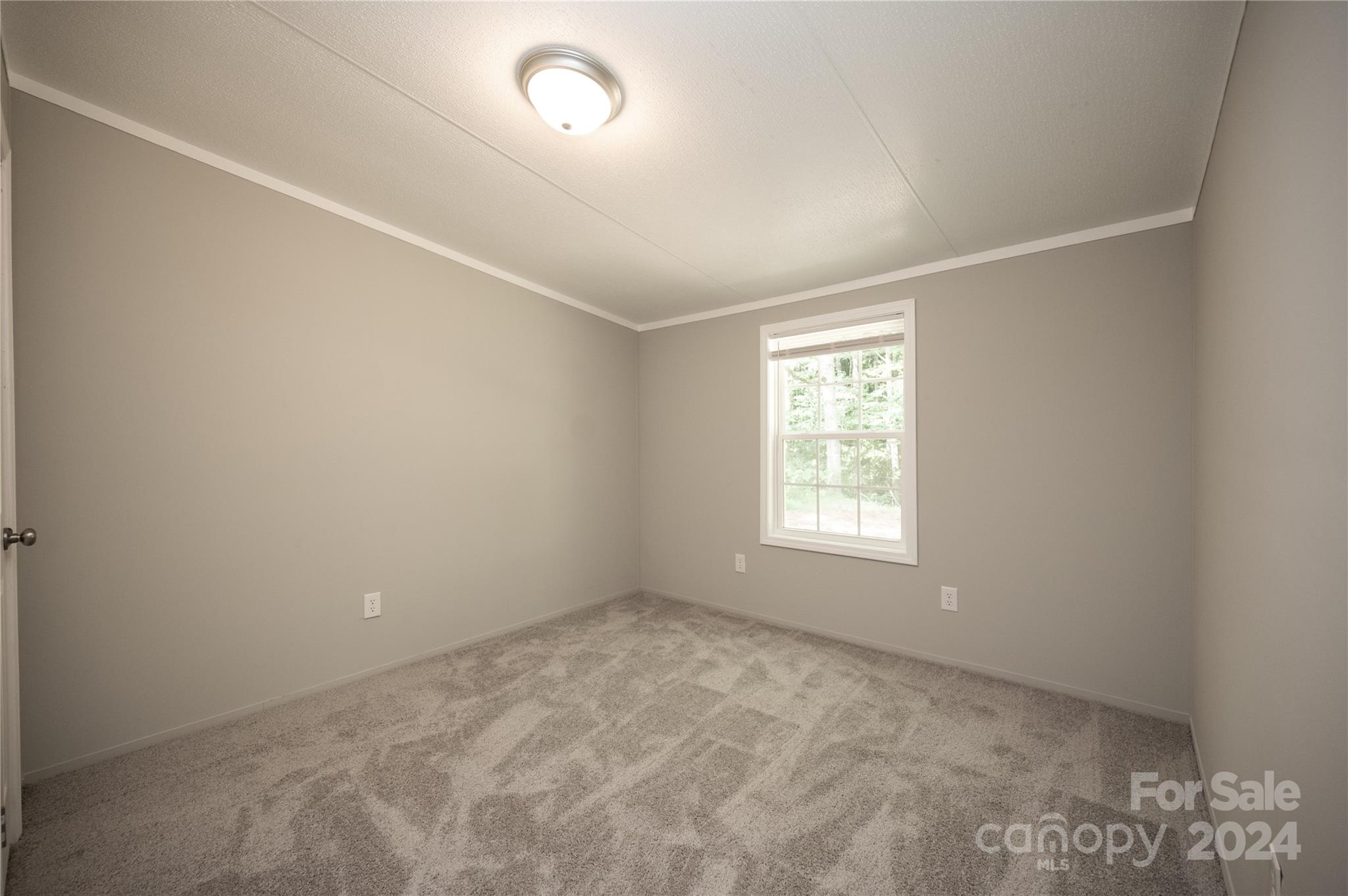 2574 Orchard Road Smyrna, SC 29743 - Photo 14 of 17 an empty room with a window