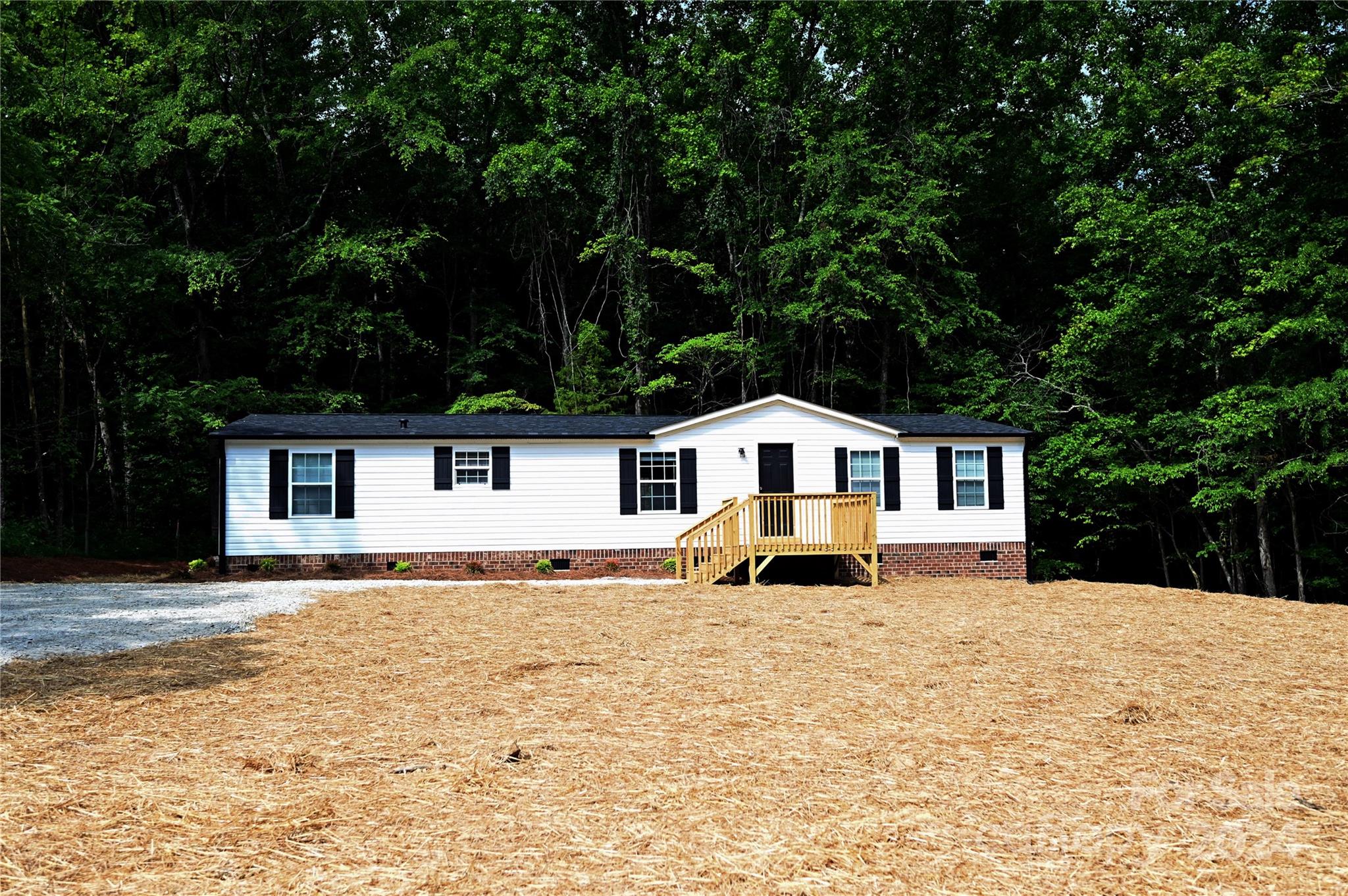 2574 Orchard Road Smyrna, SC 29743 - Photo 2 of 17 a front view of a house with a yard
