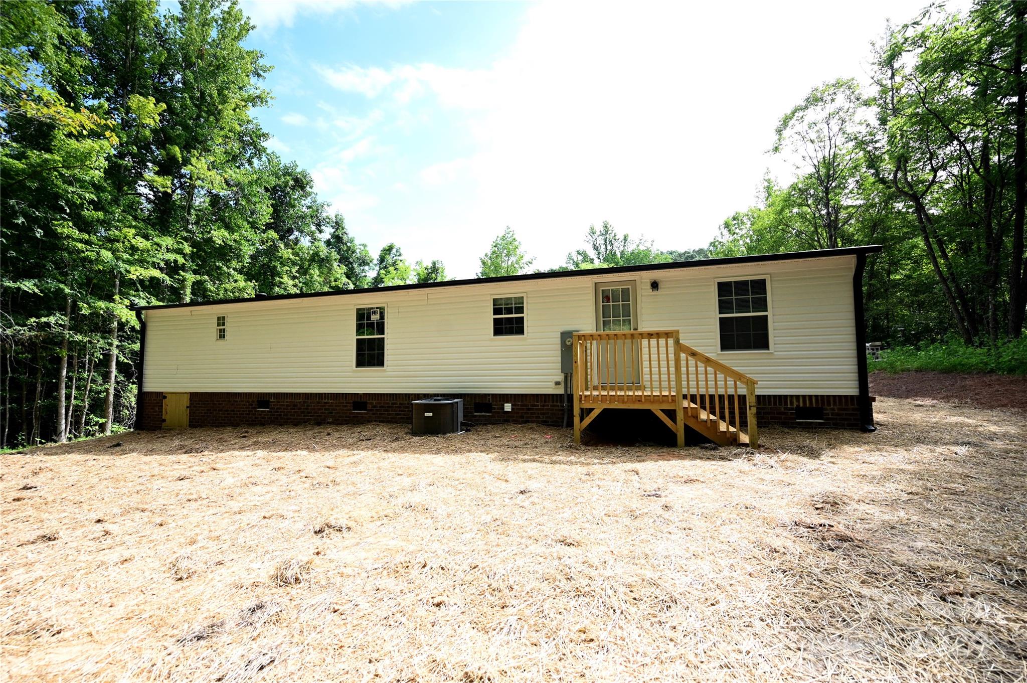 2574 Orchard Road Smyrna, SC 29743 - Photo 3 of 17 a view of a house with a yard covered with snow in the background