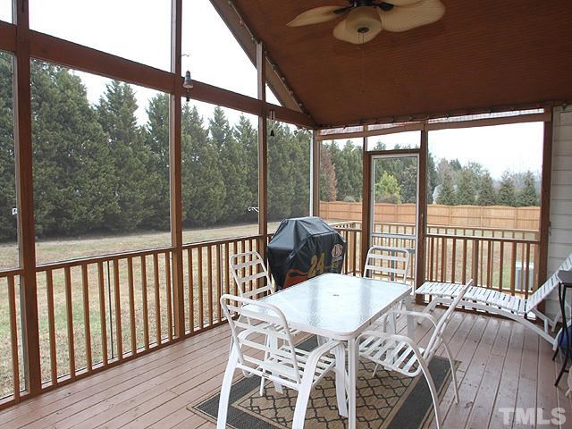 1017 Holland Ridge Drive Raleigh, NC 27603 - Photo 20 of 24 a view of a dining room with furniture window and wooden floor