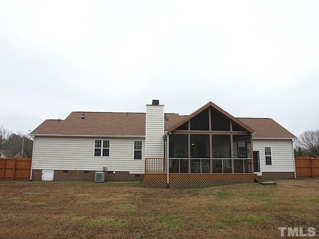 1017 Holland Ridge Drive Raleigh, NC 27603 - Photo 3 of 24 a front view of a house with a yard
