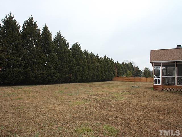 1017 Holland Ridge Drive Raleigh, NC 27603 - Photo 23 of 24 a view of an outdoor space and a yard