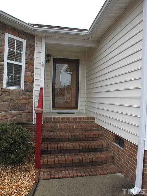 1017 Holland Ridge Drive Raleigh, NC 27603 - Photo 4 of 24 a front view of a house with a garage