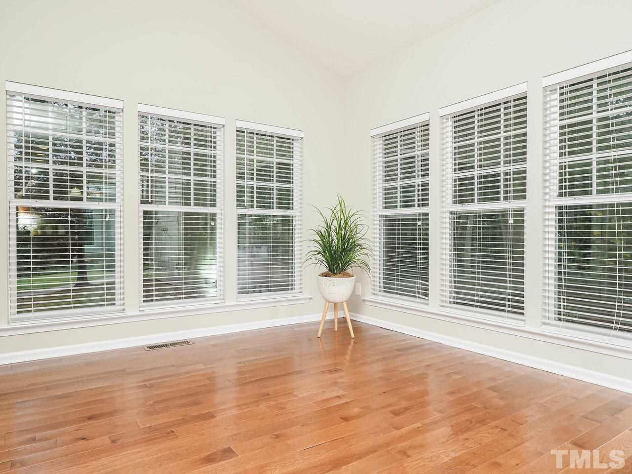 895 Seastone Street Raleigh, NC 27603 - Photo 4 of 15 Bright, light filled sunroom. Great start to the day when enjoying breakfast!