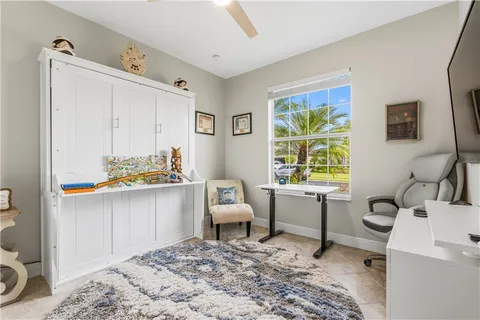 a bathroom with a sink mirror and vanity