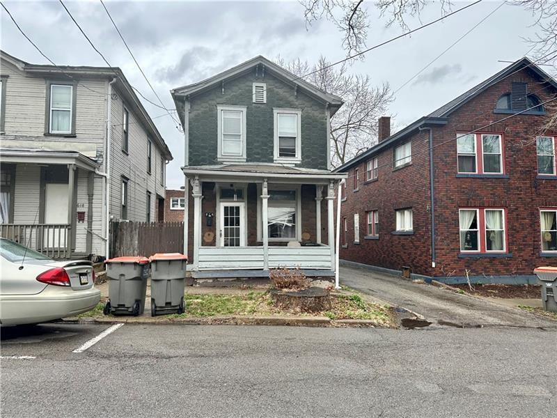 616 15th Street Beaver Falls, PA 15010 - Photo 1 of 3 a front view of a house with a yard