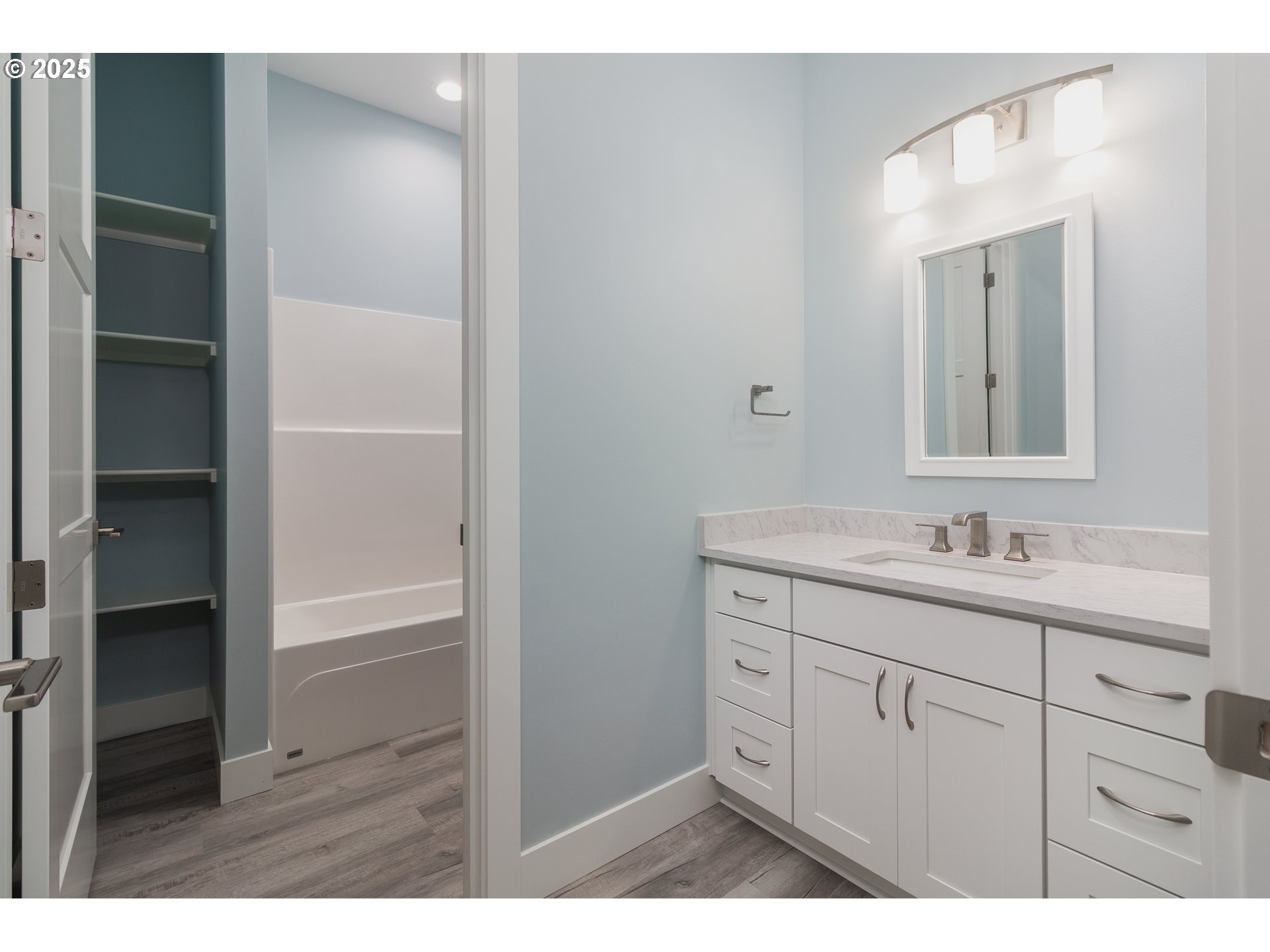 6485 Heron View Neskowin, OR 97149 - Photo 17 of 46 a bathroom with a sink vanity and a mirror