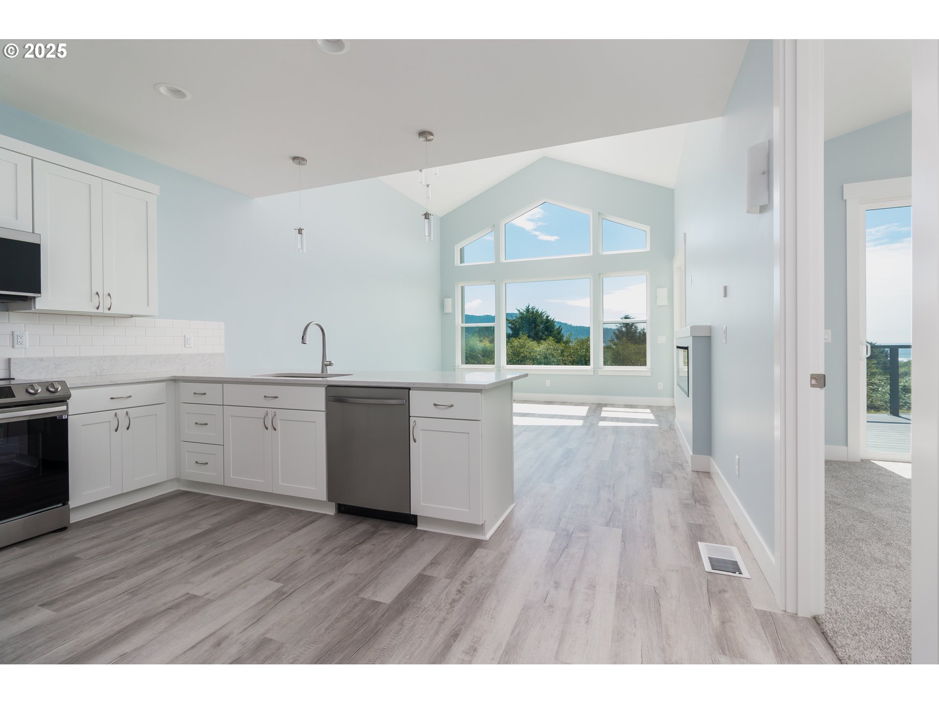 6485 Heron View Neskowin, OR 97149 - Photo 40 of 46 a kitchen with a white wooden cabinets and wooden floor