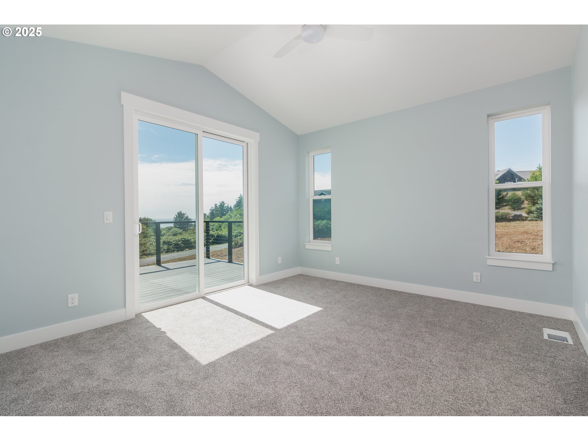6485 Heron View Neskowin, OR 97149 - Photo 9 of 46 a big room with windows and closet