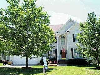 5509 Netherby Court Raleigh, NC 27613 - Photo 1 of 1 a front view of a house with a garden