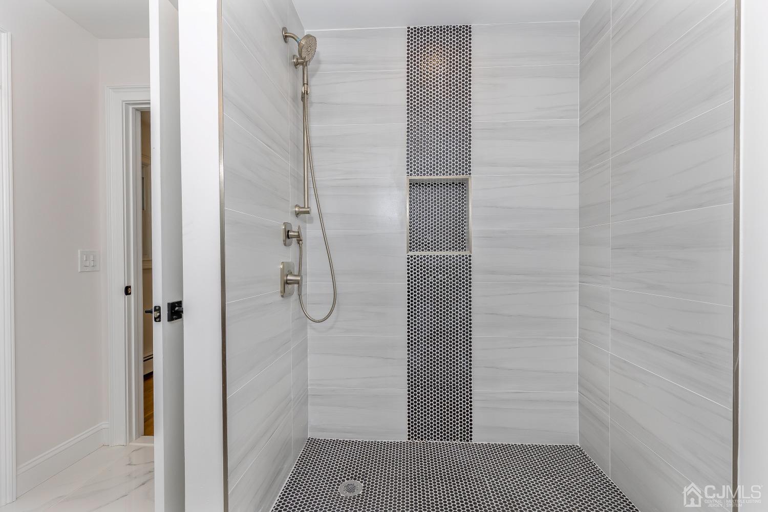 12 Annette Drive Edison, NJ 08820 - Photo 14 of 42 a bathroom with a glass shower door