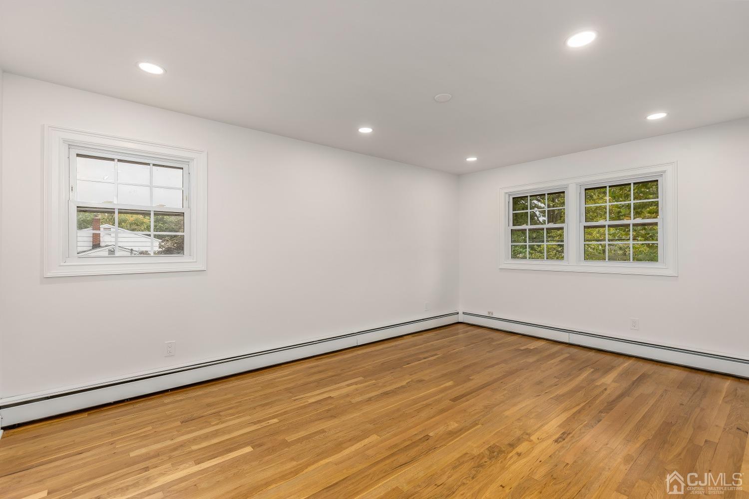 12 Annette Drive Edison, NJ 08820 - Photo 15 of 42 a view of an empty room with wooden floor and a window