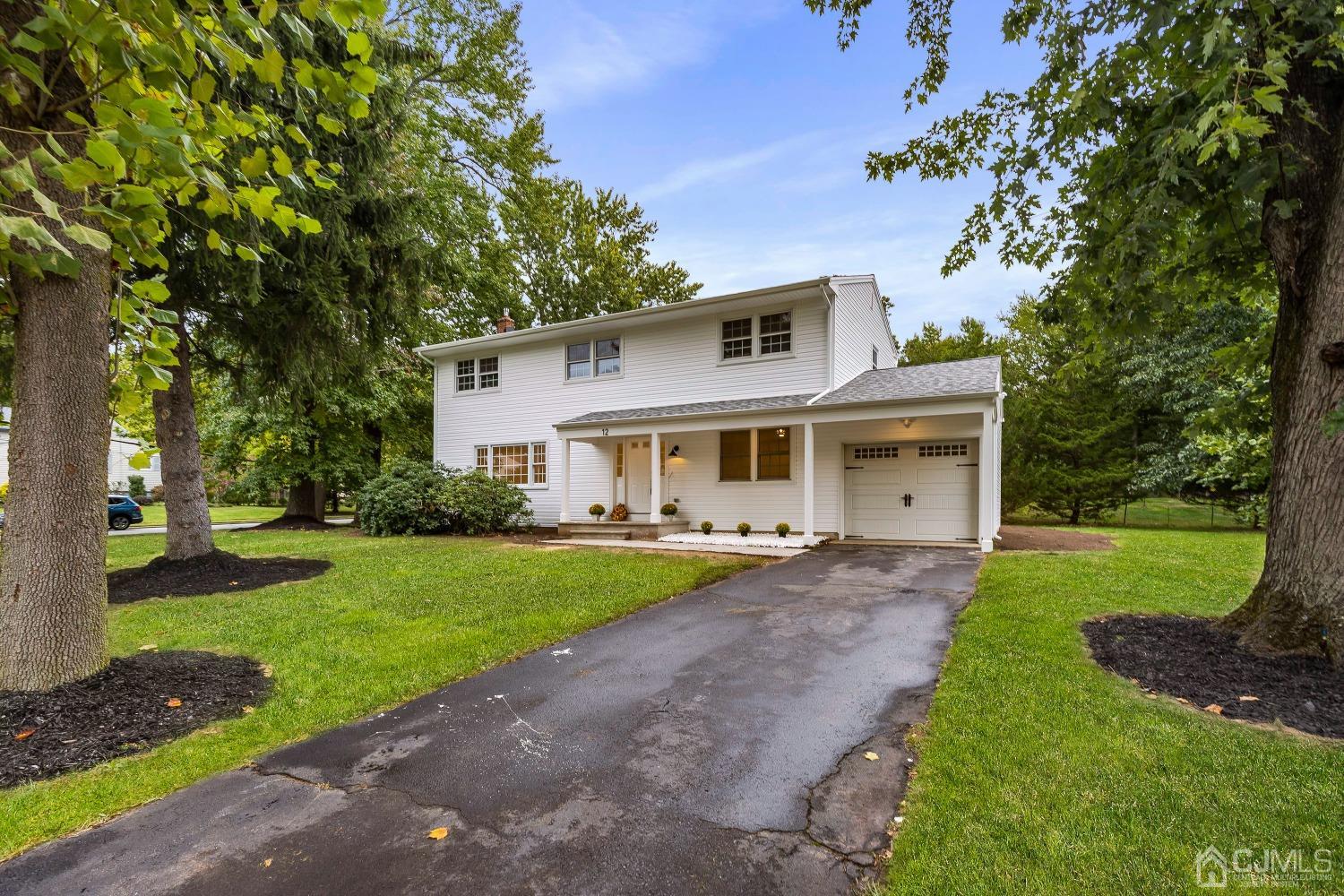 12 Annette Drive Edison, NJ 08820 - Photo 2 of 42 a front view of a house with garden