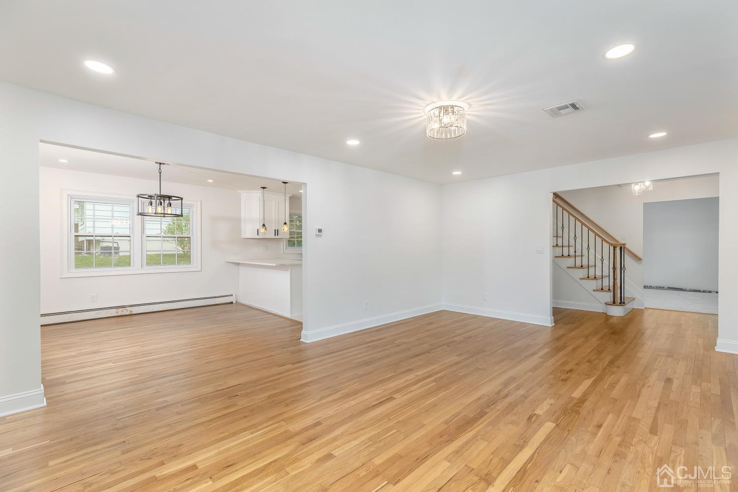 12 Annette Drive Edison, NJ 08820 - Photo 24 of 42 a view of empty room with wooden floor