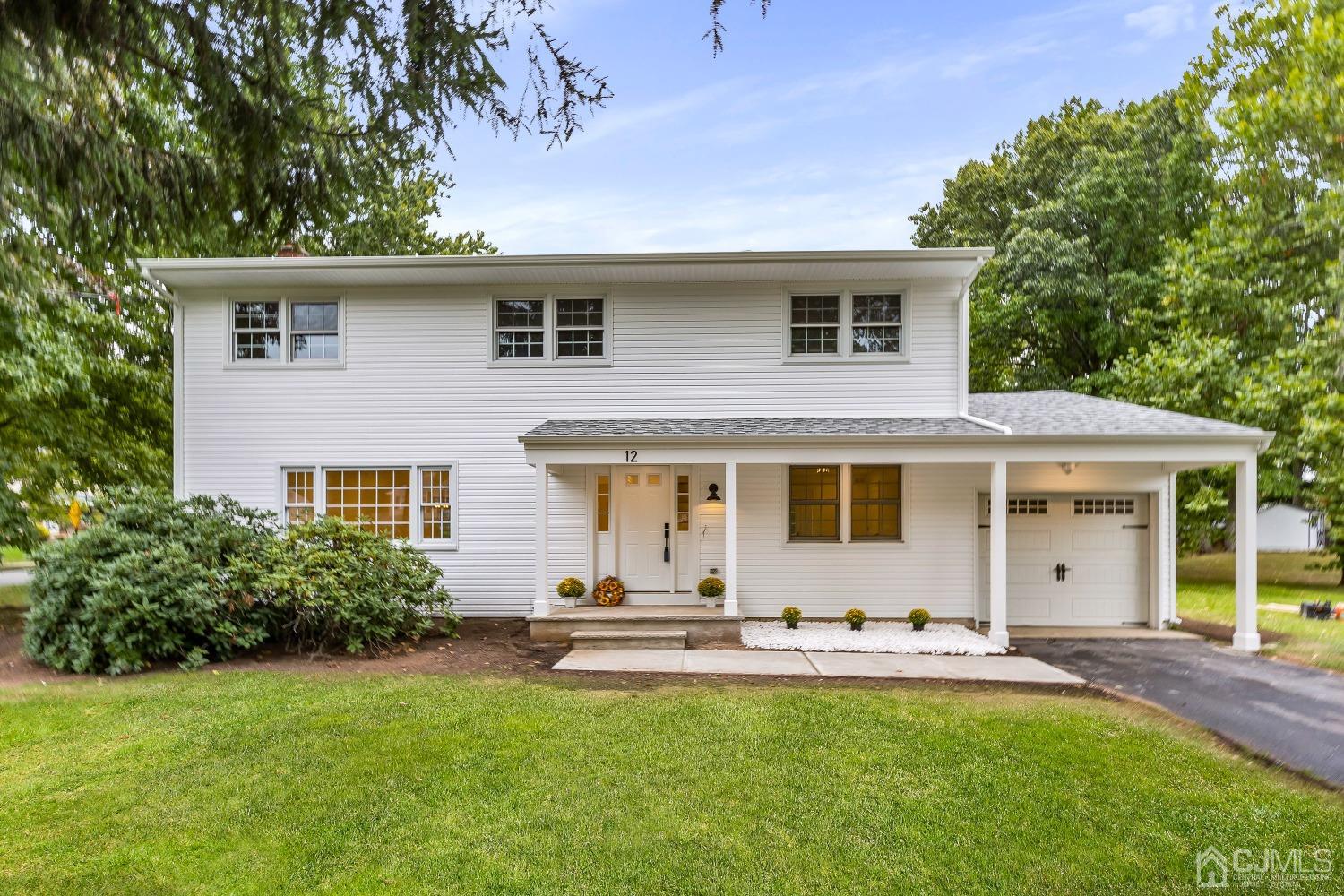 12 Annette Drive Edison, NJ 08820 - Photo 3 of 42 a front view of house with yard and outdoor seating