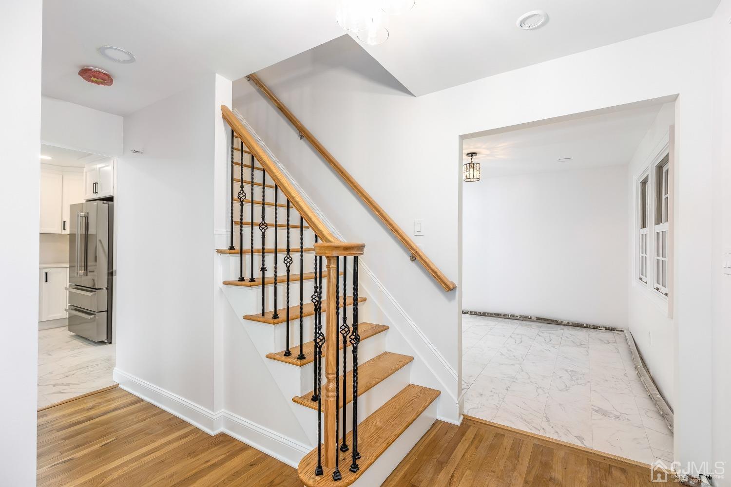 12 Annette Drive Edison, NJ 08820 - Photo 32 of 42 a view of entryway with wooden floor and stairs