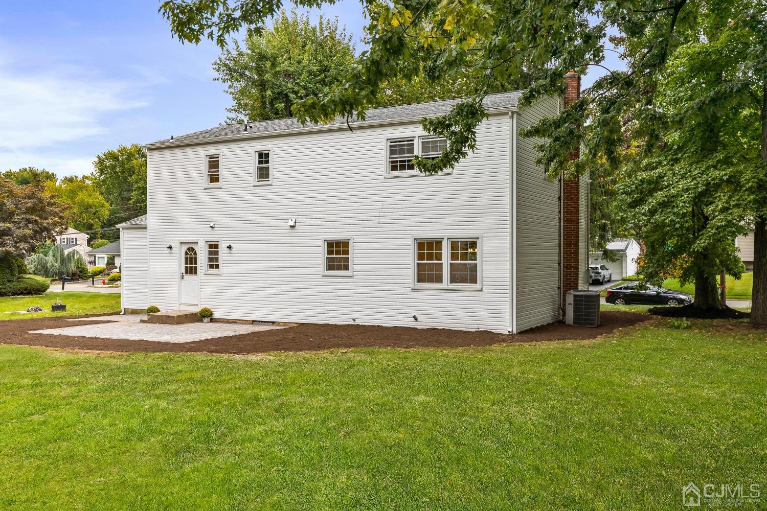 12 Annette Drive Edison, NJ 08820 - Photo 40 of 42 a view of a house with backyard and a tree