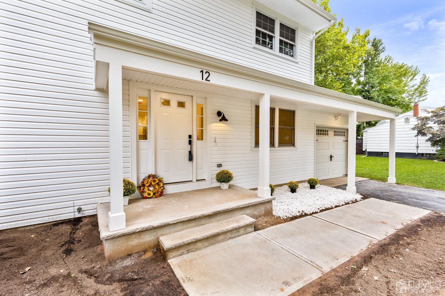 12 Annette Drive Edison, NJ 08820 - Photo 5 of 42 a backyard of a house with potted plants and seating space