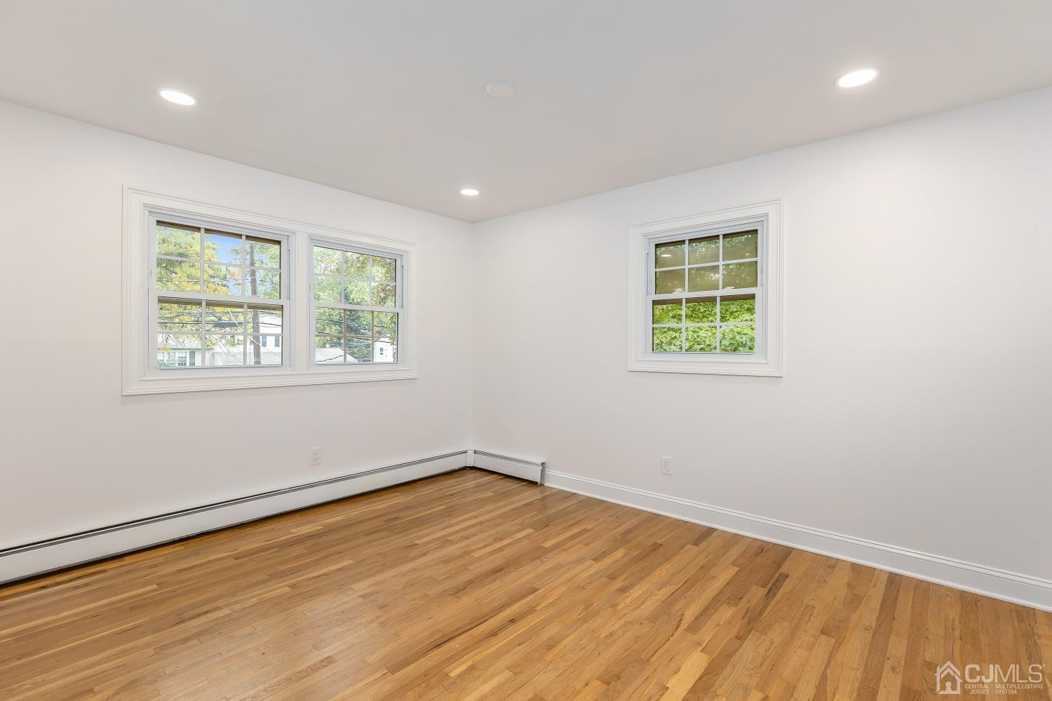 12 Annette Drive Edison, NJ 08820 - Photo 8 of 42 wooden floor in an empty room with a window