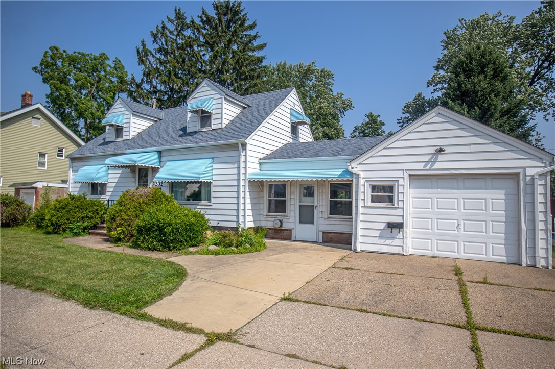 8202 Snow Road Parma, OH 44129 - Photo 2 of 29 Cape cod home featuring garage