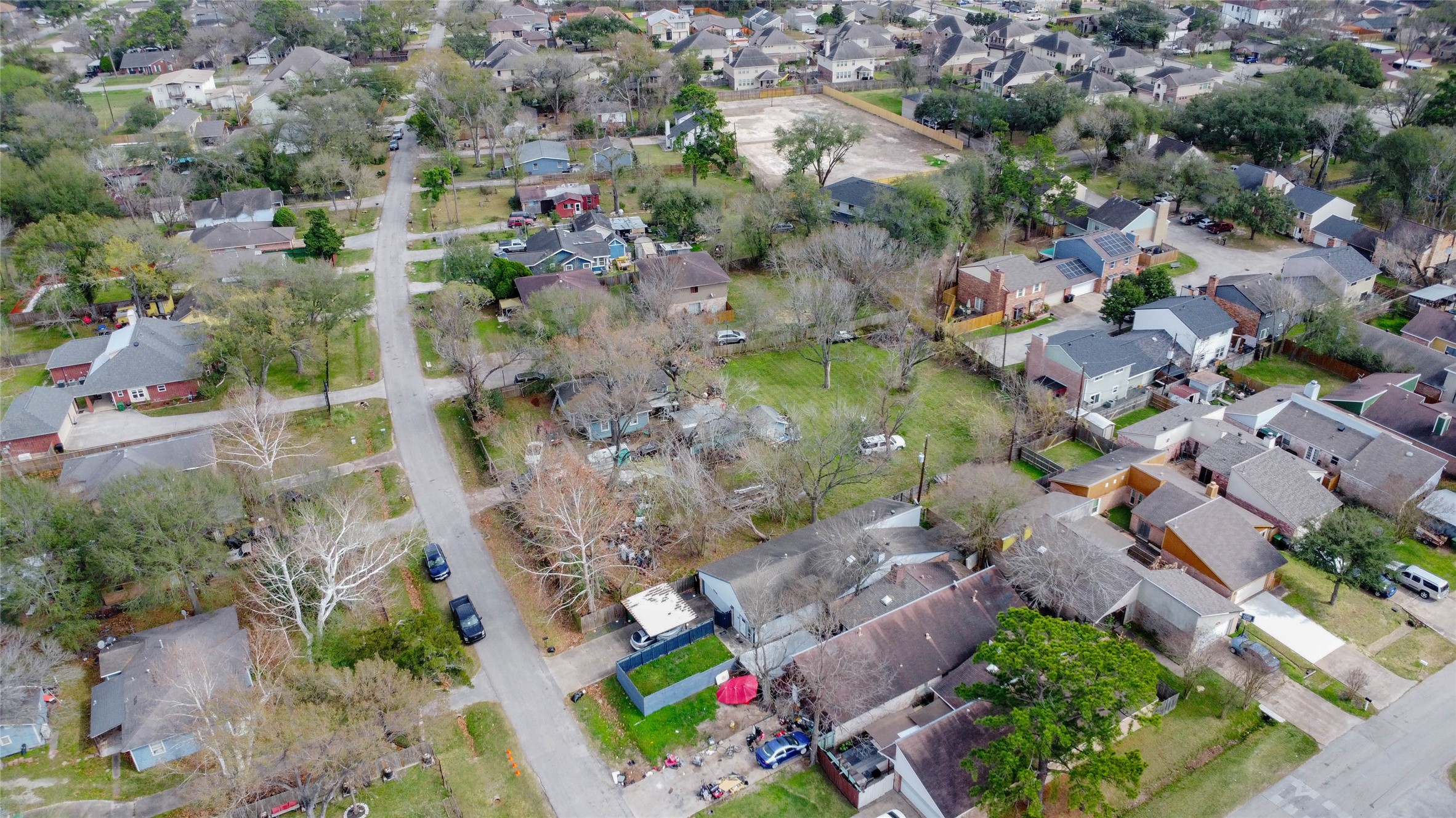 9229 Kerrwood Lane Houston, TX 77080 - Photo 3 of 12 Elevated neighborhood view capturing the property’s central position within a well-established residential pocket of Spring Branch. The generous lot size stands out among surrounding homes, offering rare scale and flexibility. Tree-lined streets, nearby new construction, and consistent residential density emphasize the strong redevelopment momentum and long-term upside this oversized parcel presents.