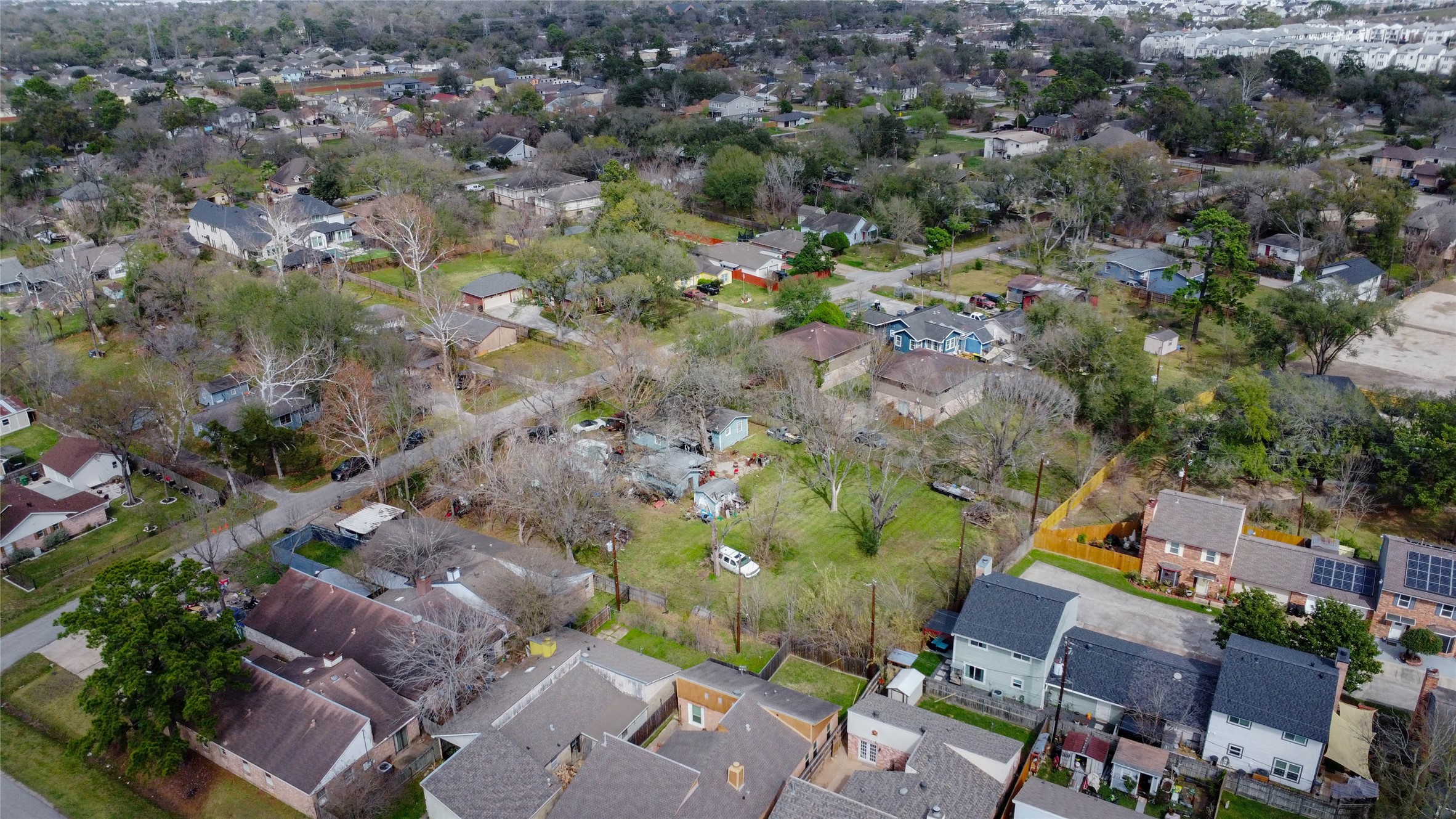 9229 Kerrwood Lane Houston, TX 77080 - Photo 7 of 12 High-elevation perspective capturing the surrounding community density and accessibility. Major roadways and commercial corridors are within convenient reach, while the immediate neighborhood remains residential and established. This balance of connectivity and neighborhood character enhances the long-term desirability of future new construction on the site.