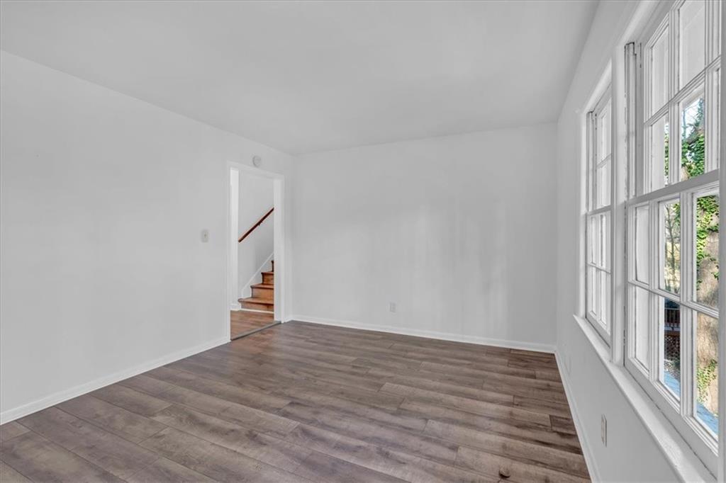 2080 Bluffton Way Decatur, GA 30035 - Photo 12 of 48 a view of empty room with wooden floor and fan