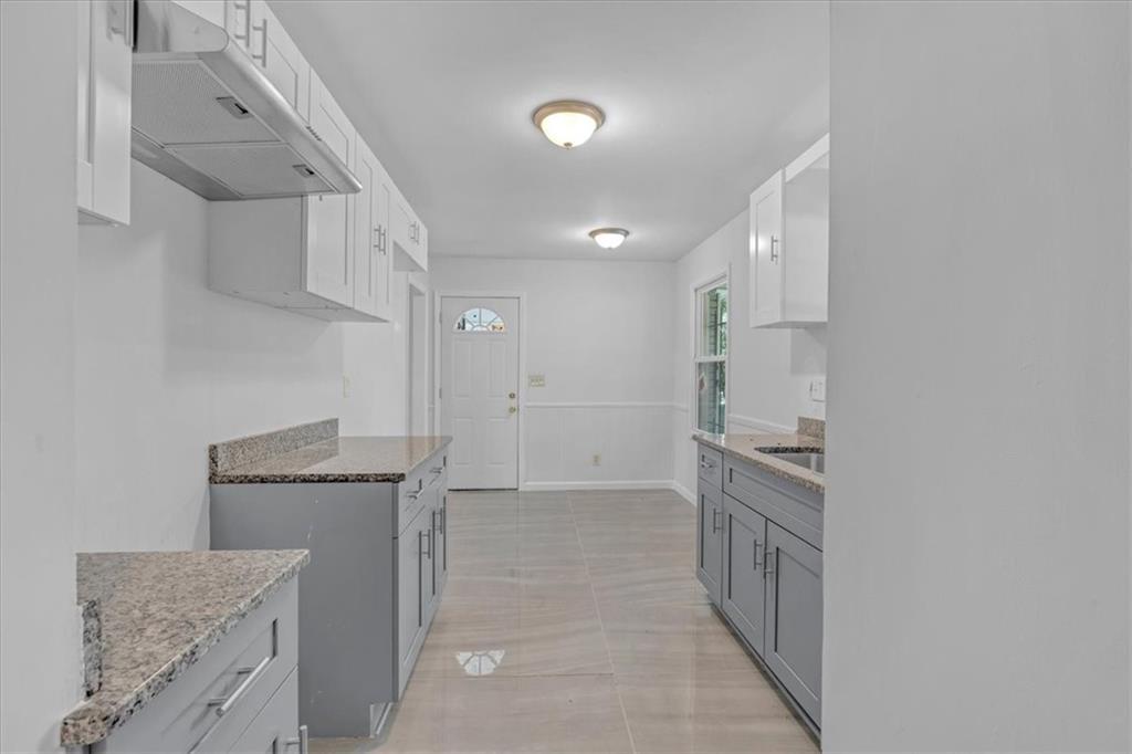 2080 Bluffton Way Decatur, GA 30035 - Photo 13 of 48 a spacious bathroom with a granite countertop sink and a mirror