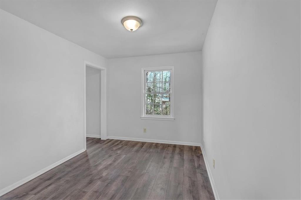 2080 Bluffton Way Decatur, GA 30035 - Photo 19 of 48 an empty room with wooden floor and windows