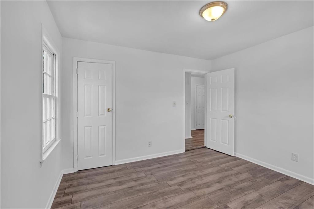 2080 Bluffton Way Decatur, GA 30035 - Photo 24 of 48 a view of an empty room and wooden floor