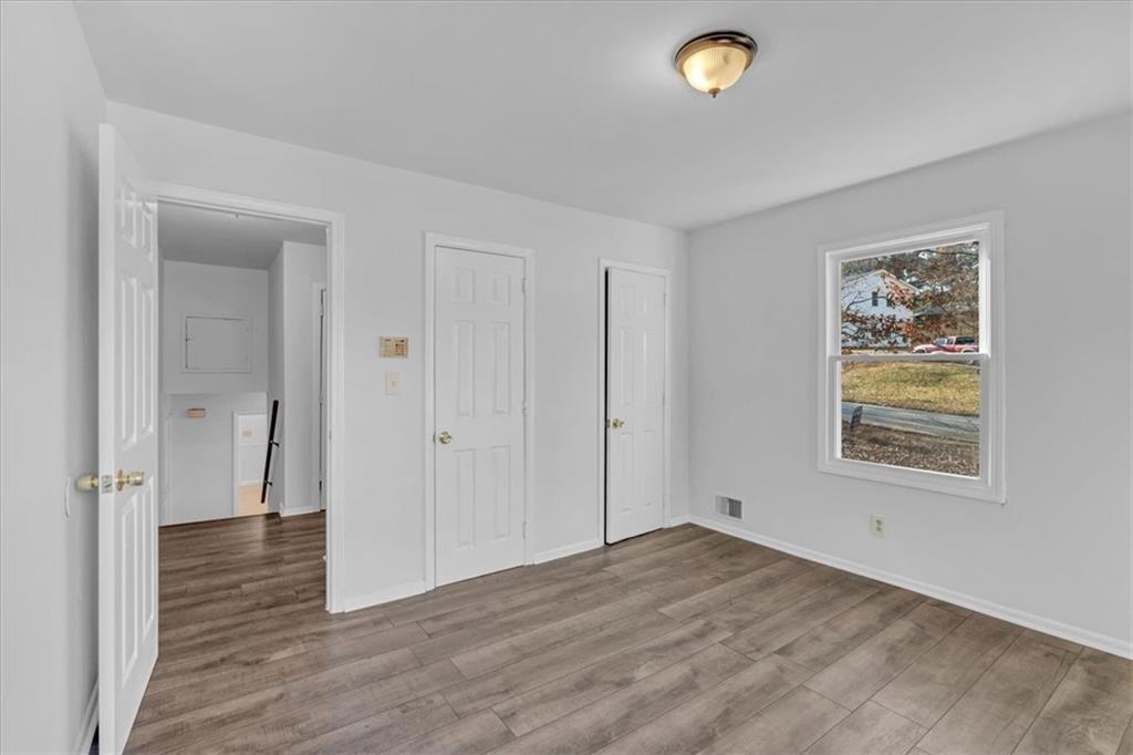 2080 Bluffton Way Decatur, GA 30035 - Photo 29 of 48 an empty room with wooden floor and window