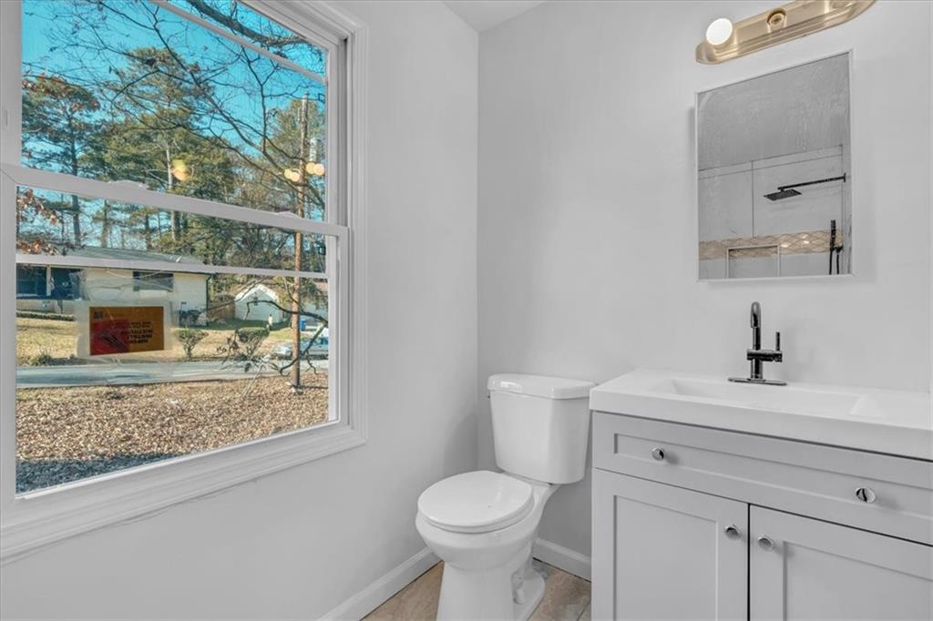 2080 Bluffton Way Decatur, GA 30035 - Photo 31 of 48 a white toilet sitting next to a bathroom sink