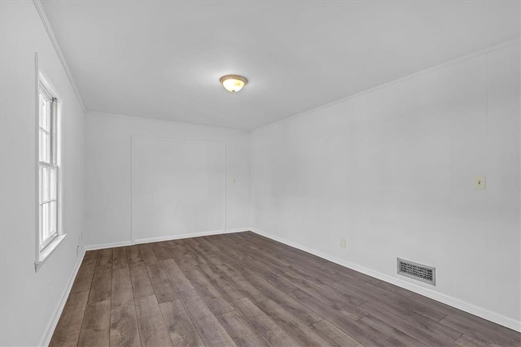 2080 Bluffton Way Decatur, GA 30035 - Photo 36 of 48 an empty room with wooden floor and windows