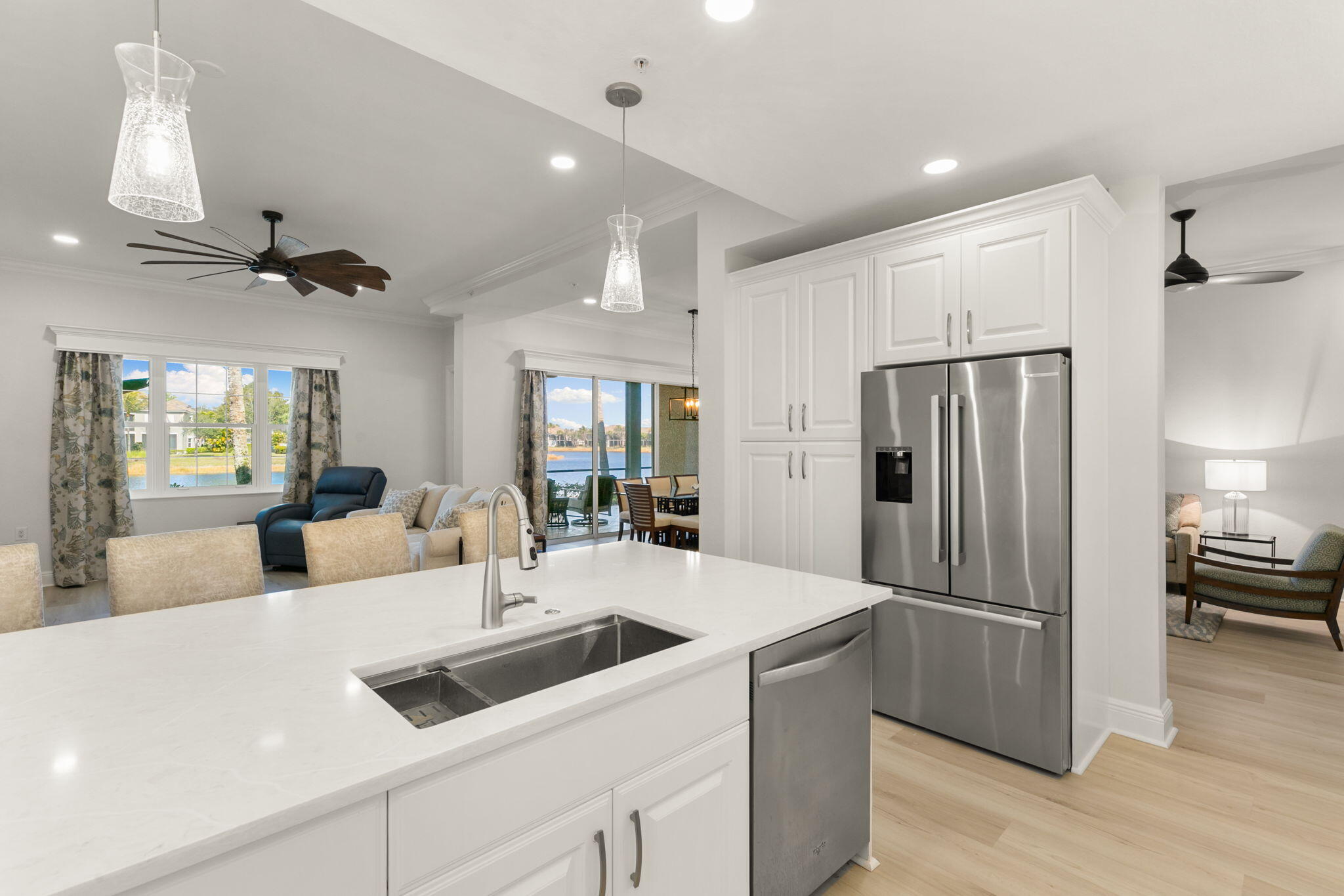 9213 Museo Circle, Unit 103 Naples, FL 34114 - Photo 7 of 47 a kitchen with a refrigerator a sink and a refrigerator